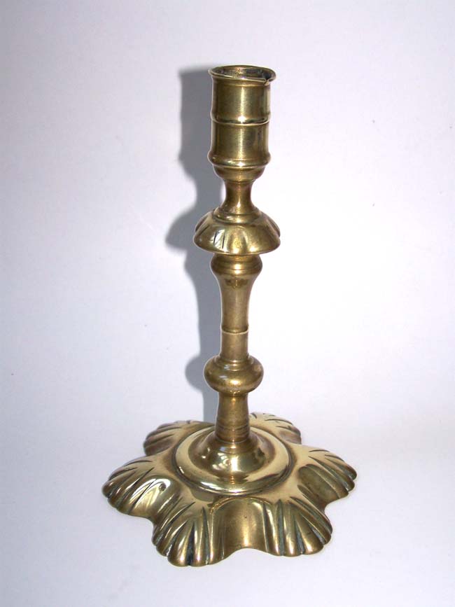 An English Georgian period Brass Petal Base Candlestick circa 1750